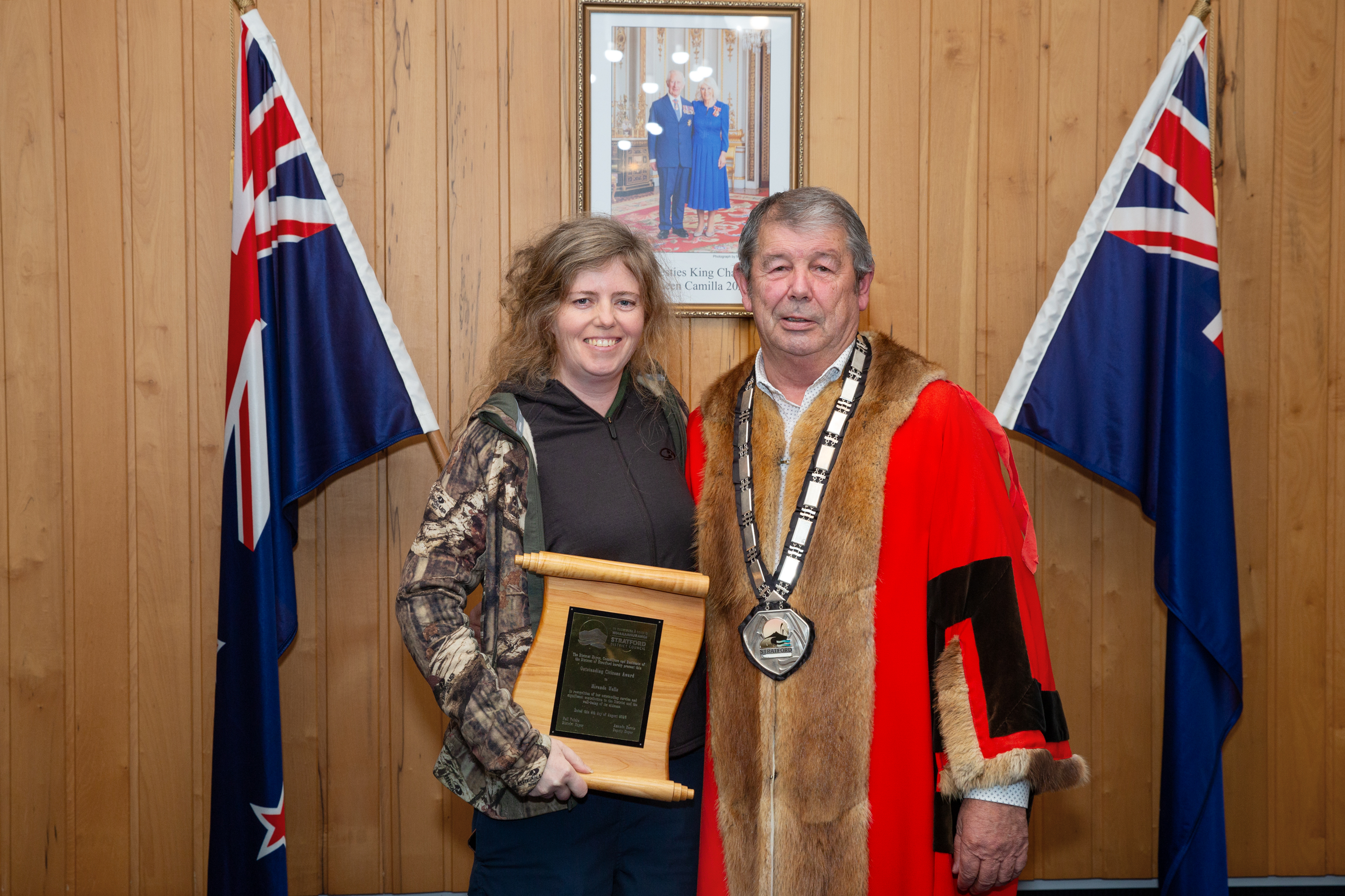 Miranda Wells holding the Outstanding Citizen Award plaque beside Stratford District Mayor Neil Volzke